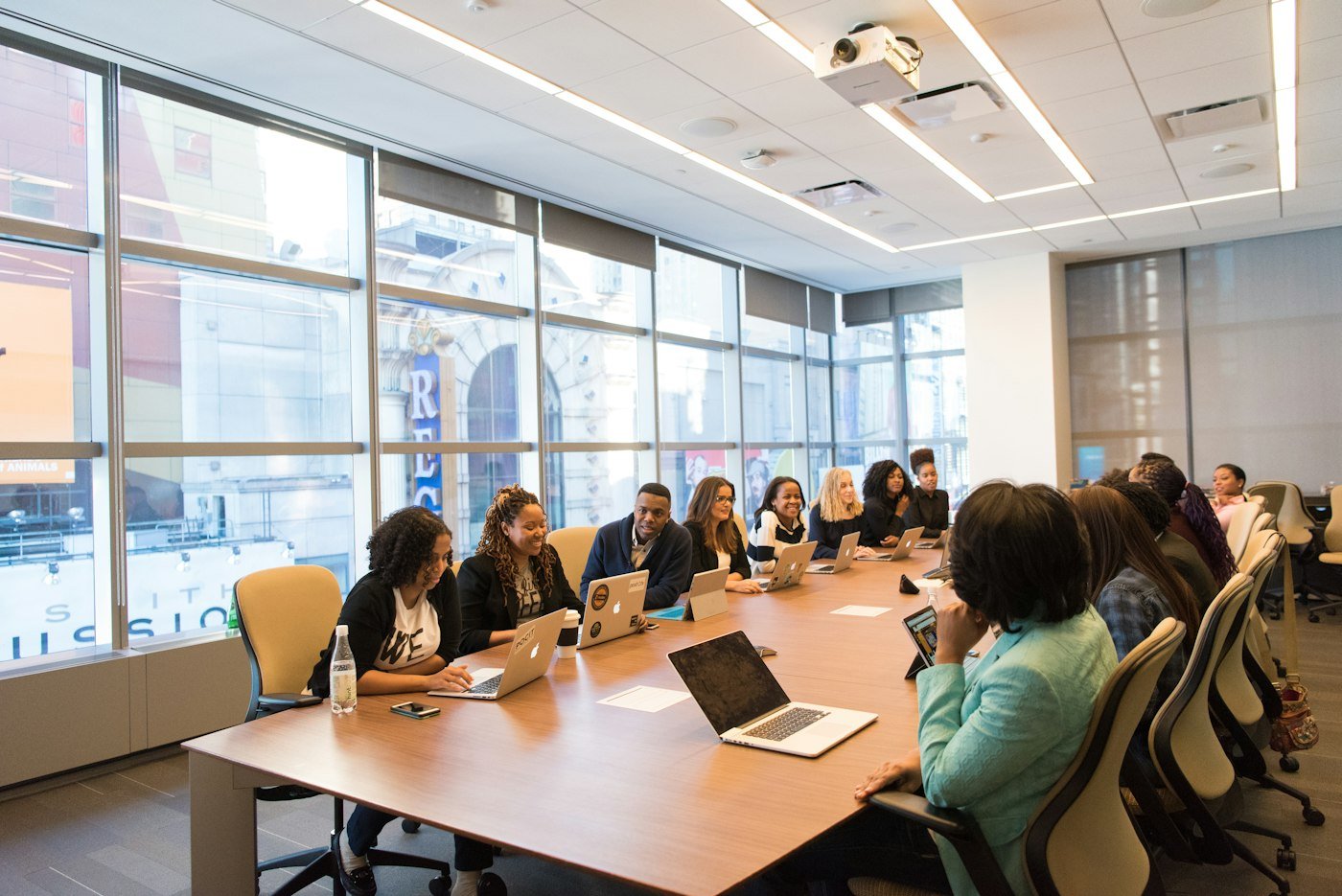 Senior leaders in discussion around a boardroom table